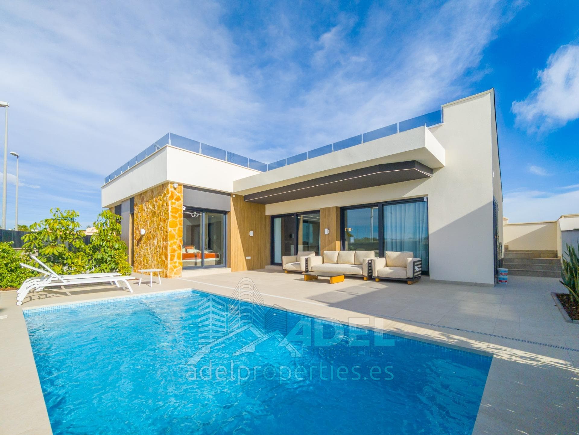 Modern single-story villa with solarium, private pool, garden, and parking