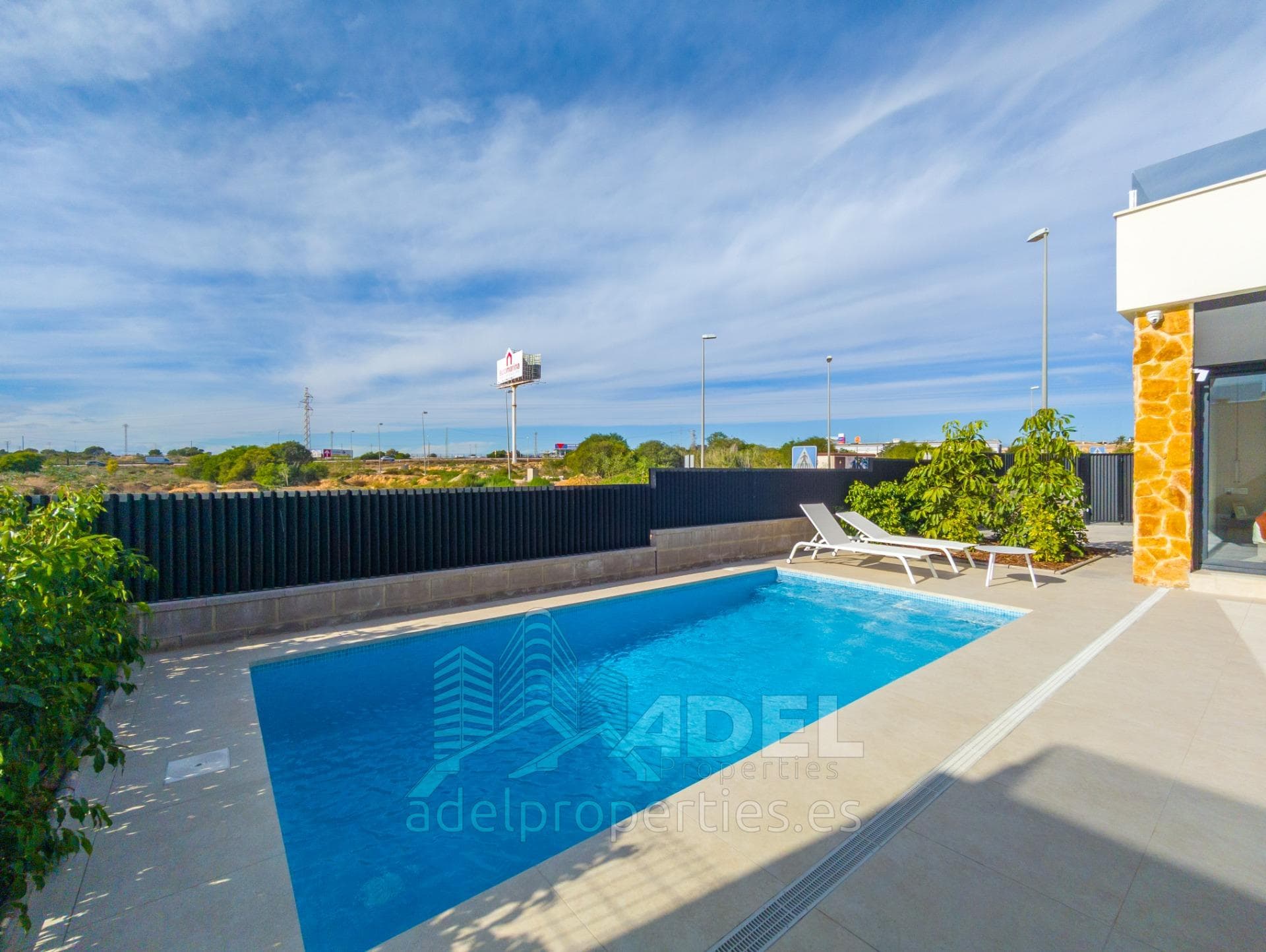 Modern single-story villa with solarium, private pool, garden, and parking 2